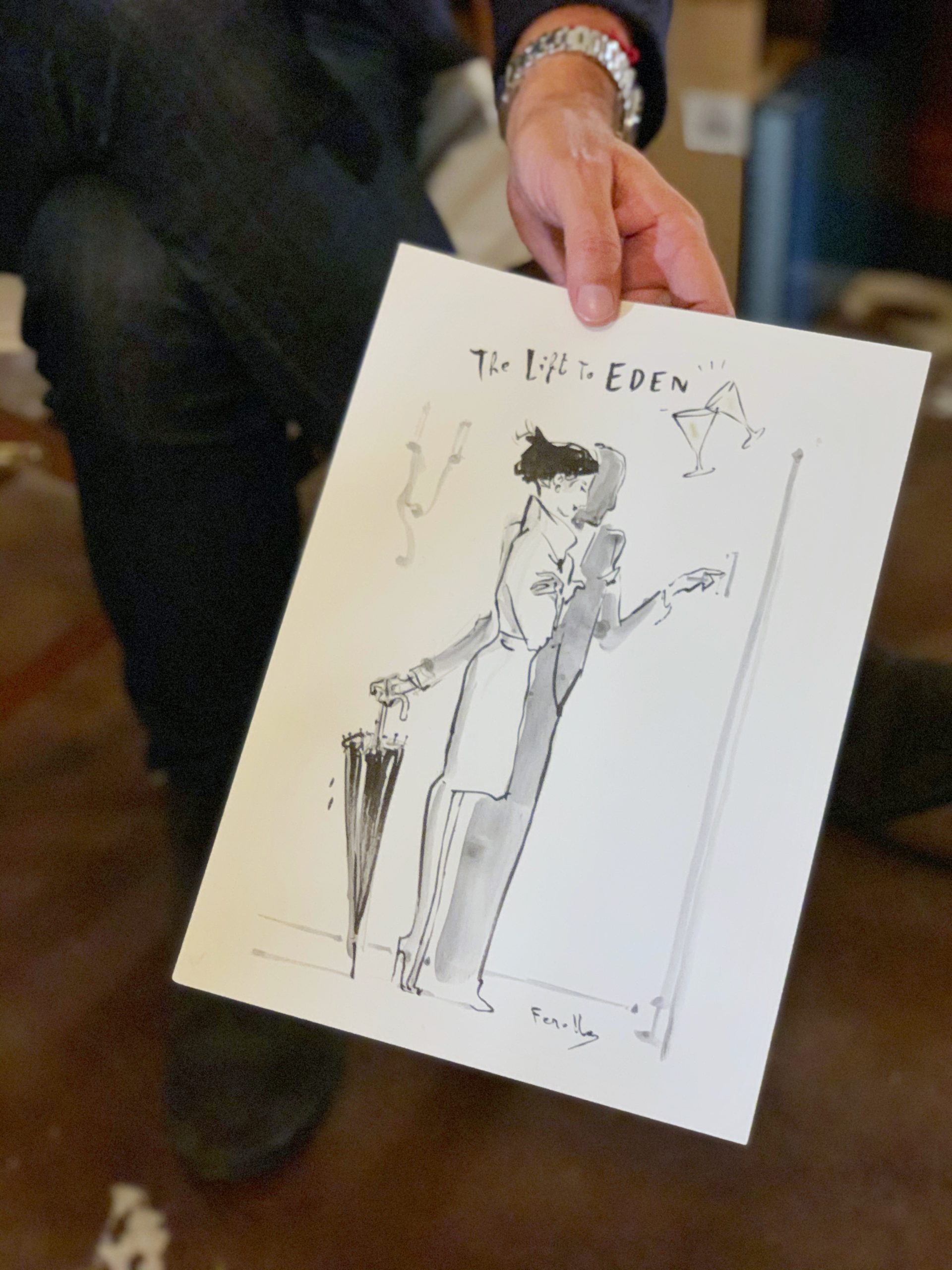 Andrea Ferolla holds one of his drawings from the Hotel Eden.