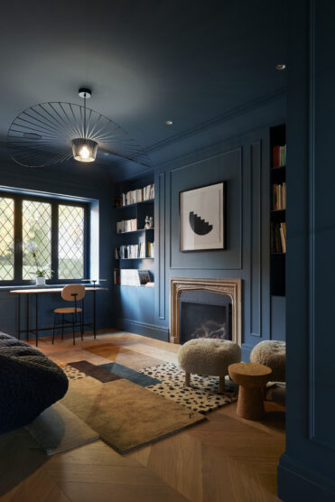 MBM House navy blue room with fireplace