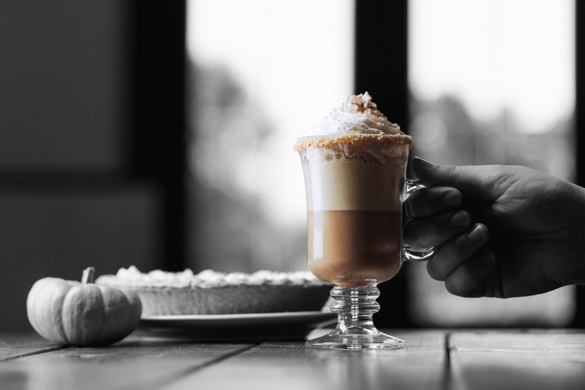 Five Farms Irish Cream Liqueur Pumpkin Pie Latte on table with pumpkin and pumpkin pie