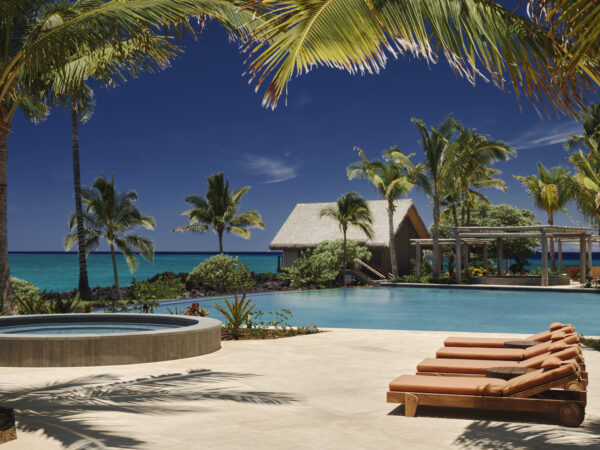 Kona Village Rosewood Resort hotel pool and outdoor lounge area