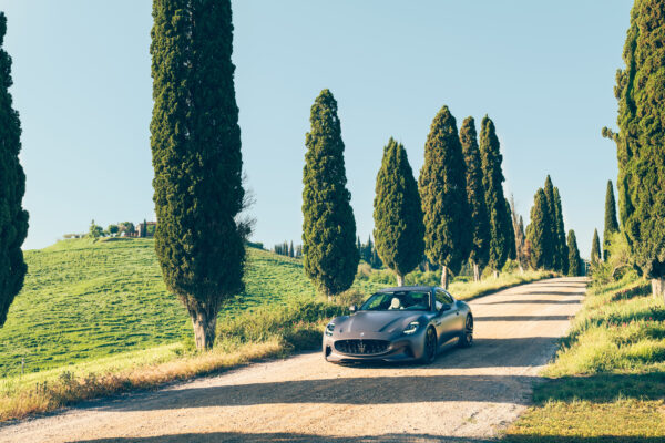 Grey Maserati driving through Italy