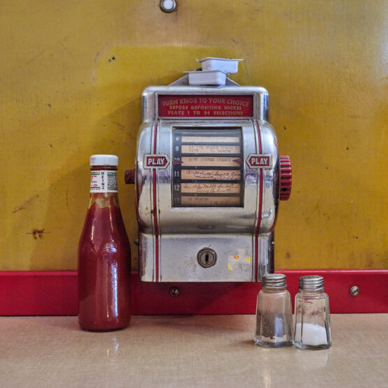 American diner table with ketchup and jukebox